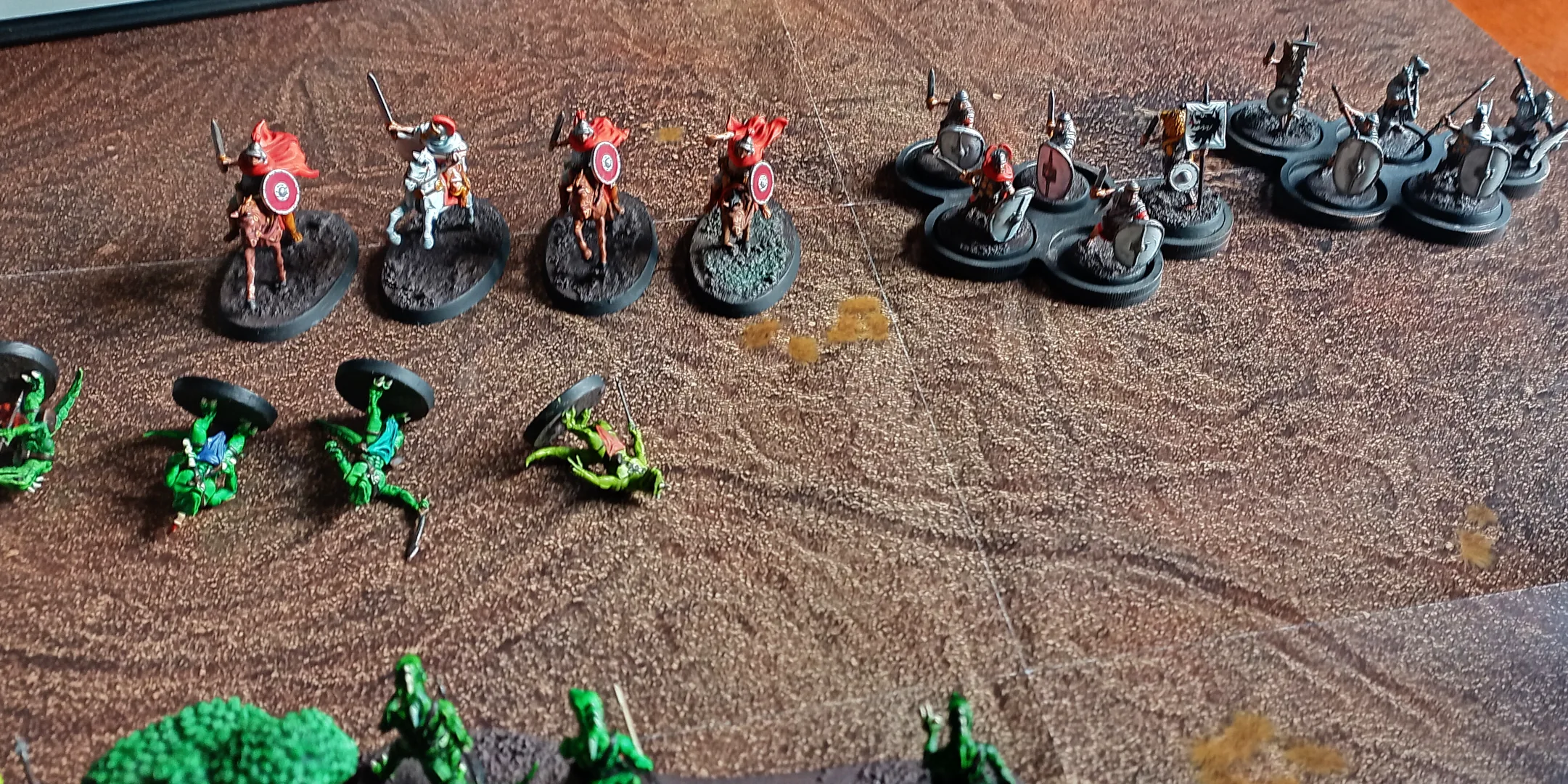 The front-line of the lizardfolk are prone as the Romans advance.