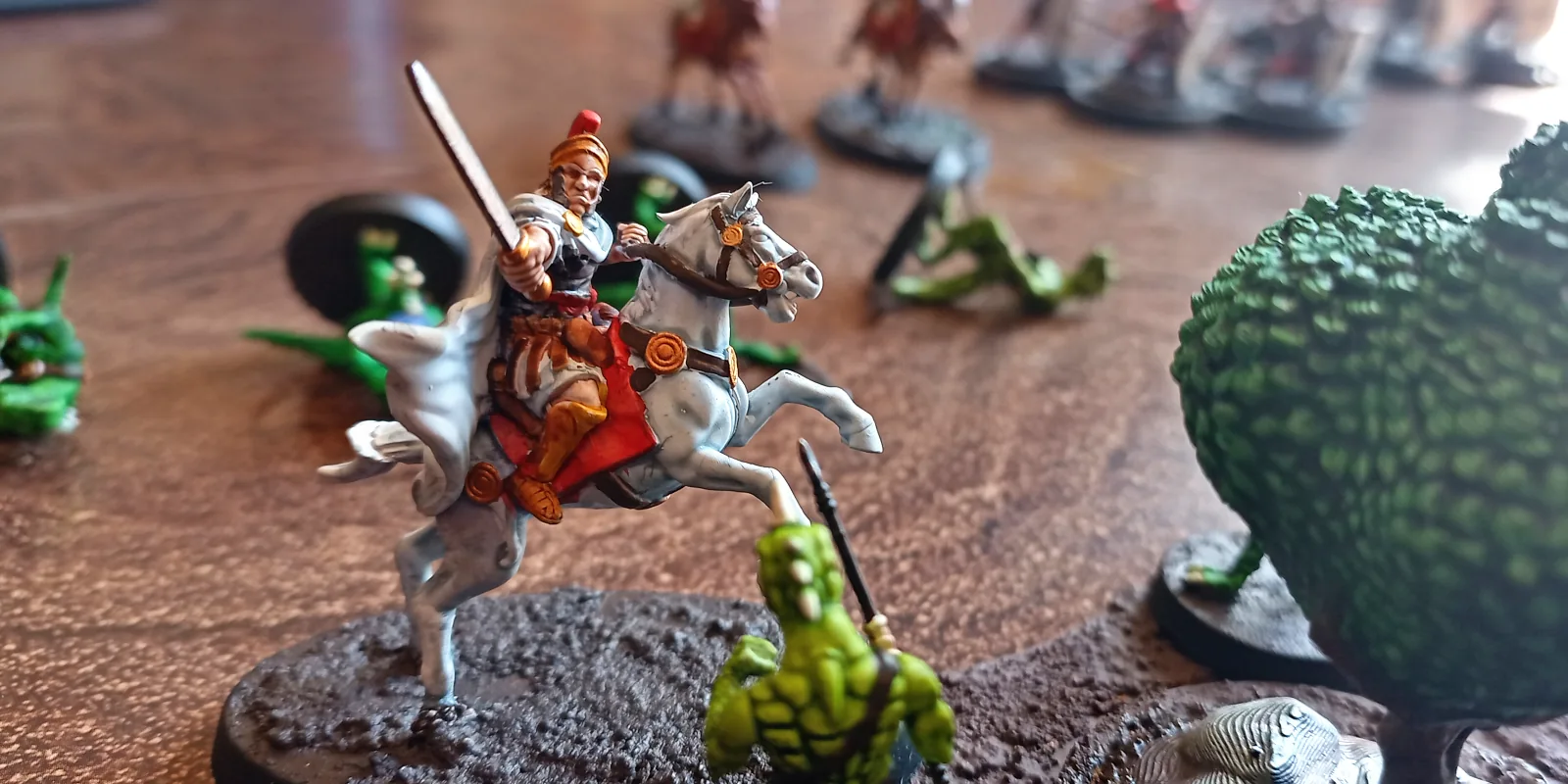 Roman equites confronts a lizardperson warrior.