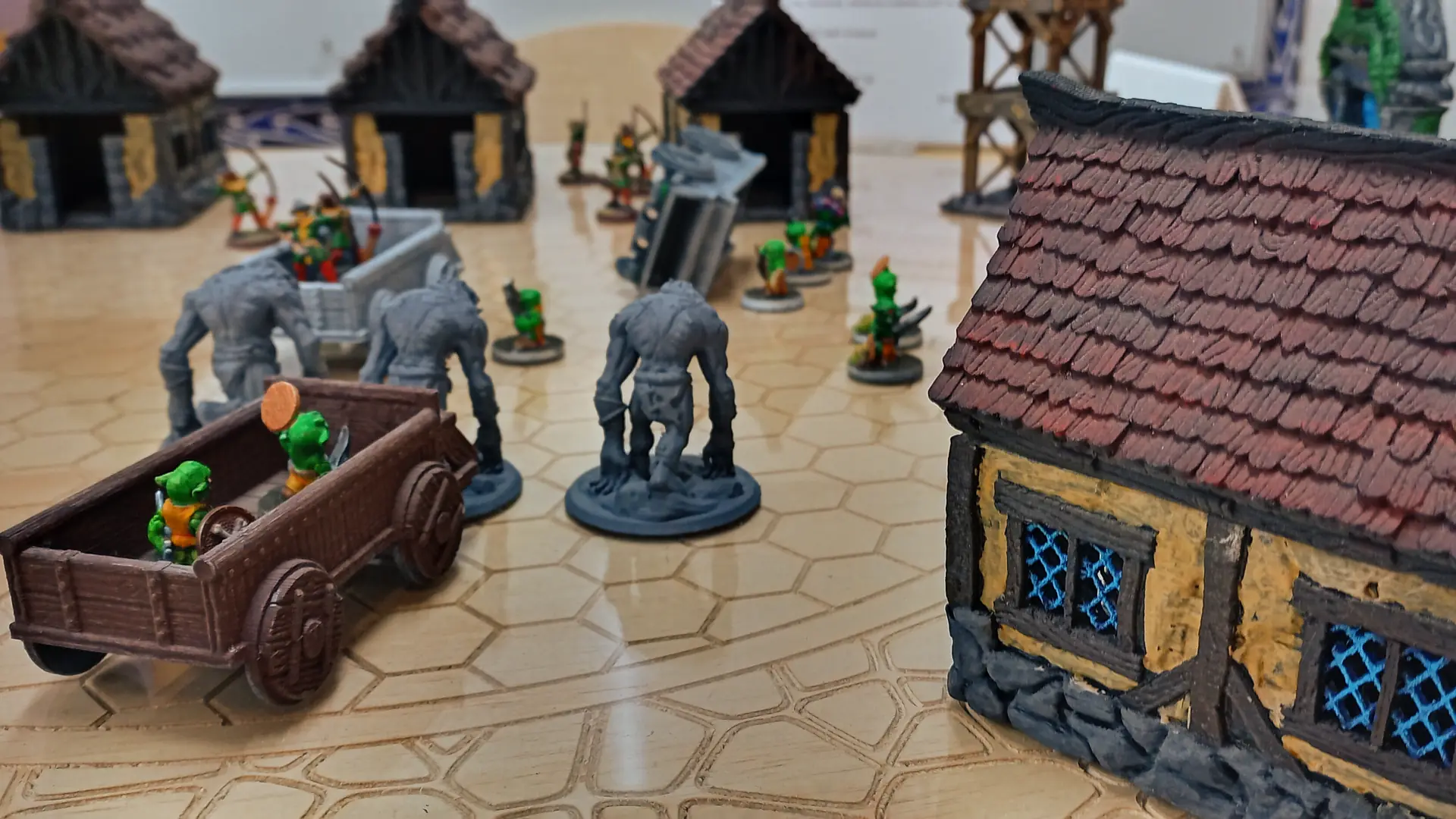 A tabletop at KapCon with miniatures on it